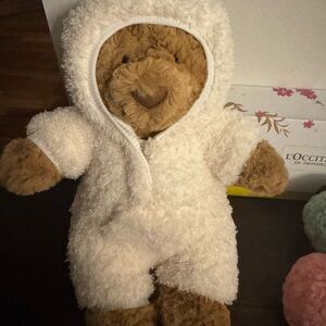 Jellycat Bartholomew Bear in a onesie.